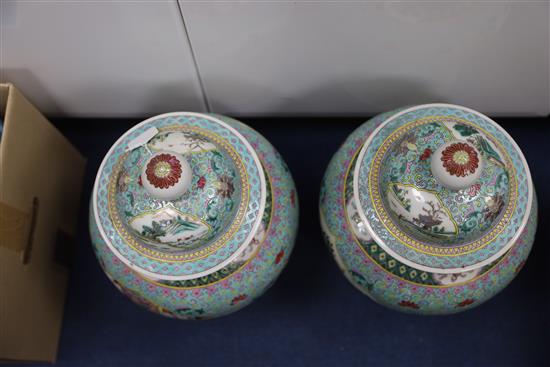 A pair of Chinese famille rose jars and covers, late 19th century, H. 45.5cm